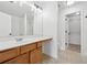 Bathroom features a large vanity, mirror, and access to a walk-in closet at 2130 Executive Dr, Duluth, GA 30096