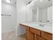 Bathroom featuring a vanity with a sink and a walk-in shower with a glass door at 2130 Executive Dr, Duluth, GA 30096