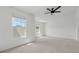 Bright bedroom boasts two large windows and a ceiling fan at 2130 Executive Dr, Duluth, GA 30096