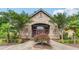 A stately community clubhouse with stone facade and well-manicured landscaping at 2130 Executive Dr, Duluth, GA 30096