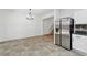 Dining area with chandelier and stainless steel refrigerator conveniently located near the stairs at 2130 Executive Dr, Duluth, GA 30096