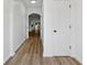 Bright entryway featuring sleek hardwood floors, fresh white paint, and a view to additional rooms at 2130 Executive Dr, Duluth, GA 30096