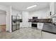 This kitchen boasts a stainless steel refrigerator, and ample counter space at 2130 Executive Dr, Duluth, GA 30096
