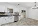 Well-lit kitchen featuring a double sink and stainless steel dishwasher near the dining area at 2130 Executive Dr, Duluth, GA 30096