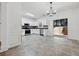 Open kitchen with stainless steel appliances, tiled floor, and a sliding glass door to the backyard at 2130 Executive Dr, Duluth, GA 30096