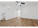 Bright living room featuring hardwood floors, white walls, and staircase leading upstairs at 2130 Executive Dr, Duluth, GA 30096