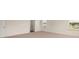 Spacious bedroom with neutral carpet, two windows, and a closet at 271 Sandy Oak Dr, Loganville, GA 30052