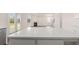Kitchen island featuring a white countertop and room to sit and enjoy your time in the kitchen at 271 Sandy Oak Dr, Loganville, GA 30052