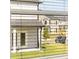 Exterior view through blinds of a house in a suburban neighborhood at 271 Sandy Oak Dr, Loganville, GA 30052