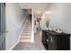Inviting entryway with neutral walls, stairs, wood-look floors, and console table at 5696 Union Pointe Dr, Union City, GA 30291
