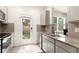 Well-lit kitchen with stainless steel appliances, granite countertops, and backyard access at 5696 Union Pointe Dr, Union City, GA 30291