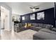 Cozy living room with large sectional sofa, ceiling fan, and stylish décor at 5696 Union Pointe Dr, Union City, GA 30291