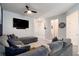 Comfortable living room featuring a large sectional, accent wall, and mounted TV at 5696 Union Pointe Dr, Union City, GA 30291