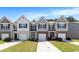 Attractive townhouses featuring brick accents, attached garages and well-maintained landscaping at 5696 Union Pointe Dr, Union City, GA 30291
