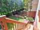 Backyard view from deck stairs with a lush lawn, beautiful landscaping, and a serene garden area at 658 Vinings Estates Se Dr, Mableton, GA 30126