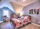 Cozy bedroom for a with sports-themed decor, and vaulted ceilings at 658 Vinings Estates Se Dr, Mableton, GA 30126