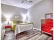Cozy bedroom featuring hardwood floors, a comfortable bed, and stylish furnishings with bright natural light at 658 Vinings Estates Se Dr, Mableton, GA 30126