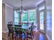 Bright breakfast nook with hardwood flooring, modern light fixture, and a view of the outdoors at 658 Vinings Estates Se Dr, Mableton, GA 30126