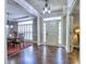 Elegant foyer featuring hardwood floors, a dining room, and a bright, welcoming entrance at 658 Vinings Estates Se Dr, Mableton, GA 30126