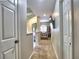 Hallway between en suite bathroom and walk-in closet with mounted TV at 658 Vinings Estates Se Dr, Mableton, GA 30126