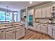 Well-lit kitchen showcases stainless steel appliances, custom cabinetry, granite countertops, and a double oven at 658 Vinings Estates Se Dr, Mableton, GA 30126