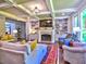 Inviting living room showcases a fireplace, built-in shelving, coffered ceilings and comfortable seating for entertaining at 658 Vinings Estates Se Dr, Mableton, GA 30126