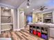 Stylish living room with hardwood floors, built-in shelving, and comfortable seating, perfect for relaxing and entertaining guests at 658 Vinings Estates Se Dr, Mableton, GA 30126