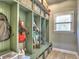 Well-organized mudroom with built-in cubbies, storage baskets, and a convenient bench at 658 Vinings Estates Se Dr, Mableton, GA 30126