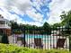 Community pool features a water slide, seating areas and beautiful landscaping at 658 Vinings Estates Se Dr, Mableton, GA 30126