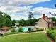 Aerial view of community pool and clubhouse surrounded by lush greenery at 658 Vinings Estates Se Dr, Mableton, GA 30126