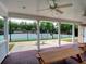 Covered outdoor seating area overlooking the community tennis court at 658 Vinings Estates Se Dr, Mableton, GA 30126