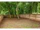 Spacious backyard with a wood fence and mature trees providing plenty of privacy at 1296 Plaza Sw Ave, Atlanta, GA 30310