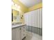Bright bathroom featuring granite countertops and a shower-tub combo at 1296 Plaza Sw Ave, Atlanta, GA 30310