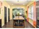Bright dining area boasts hardwood floors and a modern chandelier at 1296 Plaza Sw Ave, Atlanta, GA 30310