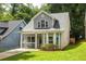 Inviting two-story home with gray siding, manicured lawn, and charming curb appeal at 1296 Plaza Sw Ave, Atlanta, GA 30310