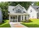 Charming two-story home with well-manicured lawn and inviting front porch at 1296 Plaza Sw Ave, Atlanta, GA 30310