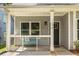 Charming front porch with seating area and modern railing, perfect for relaxing at 1296 Plaza Sw Ave, Atlanta, GA 30310