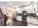 Stylish kitchen with stainless steel appliances and granite countertops at 1296 Plaza Sw Ave, Atlanta, GA 30310