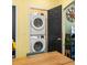Convenient laundry area features a stacked washer and dryer at 1296 Plaza Sw Ave, Atlanta, GA 30310