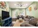Comfortable living room featuring a plush sofa, area rug, and a large television at 1296 Plaza Sw Ave, Atlanta, GA 30310
