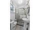 Bathroom featuring a pedestal sink, tiled shower, black and white tiled floors and natural light at 1423 Briarcliff Ne Rd, Atlanta, GA 30306