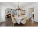 Elegant dining room with hardwood floors, chandelier, and an archway into the living room at 1423 Briarcliff Ne Rd, Atlanta, GA 30306