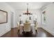 Bright dining room with hardwood floors, stylish lighting, and a view into the kitchen at 1423 Briarcliff Ne Rd, Atlanta, GA 30306