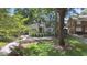 Charming home featuring a landscaped front yard, awning-covered porch, and a long driveway at 1423 Briarcliff Ne Rd, Atlanta, GA 30306