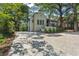 Charming home featuring a long driveway, manicured front yard and decorative accents at 1423 Briarcliff Ne Rd, Atlanta, GA 30306