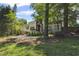 Charming home featuring a landscaped front yard, awning-covered porch, and a long driveway at 1423 Briarcliff Ne Rd, Atlanta, GA 30306