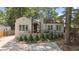 Charming home with a landscaped front yard, awning-covered porch, and large windows at 1423 Briarcliff Ne Rd, Atlanta, GA 30306