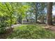 Charming home featuring a landscaped front yard, awning-covered porch, and mature trees at 1423 Briarcliff Ne Rd, Atlanta, GA 30306