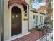 Elegant front door with a charming awning and tiled front porch at 1423 Briarcliff Ne Rd, Atlanta, GA 30306