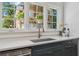 Lovely kitchen view showing the window over the sink, countertop and modern finishes at 1423 Briarcliff Ne Rd, Atlanta, GA 30306